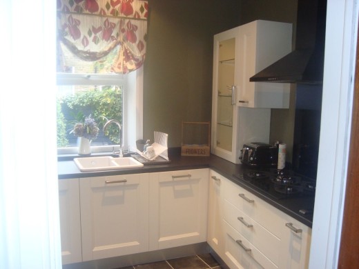 Glass display cabinet and ceramic inset sink