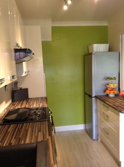 Pan drawers and cutlery tray beside the free standing fridge