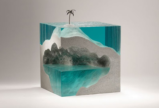 Laminated float glass, cast concrete and bronze.